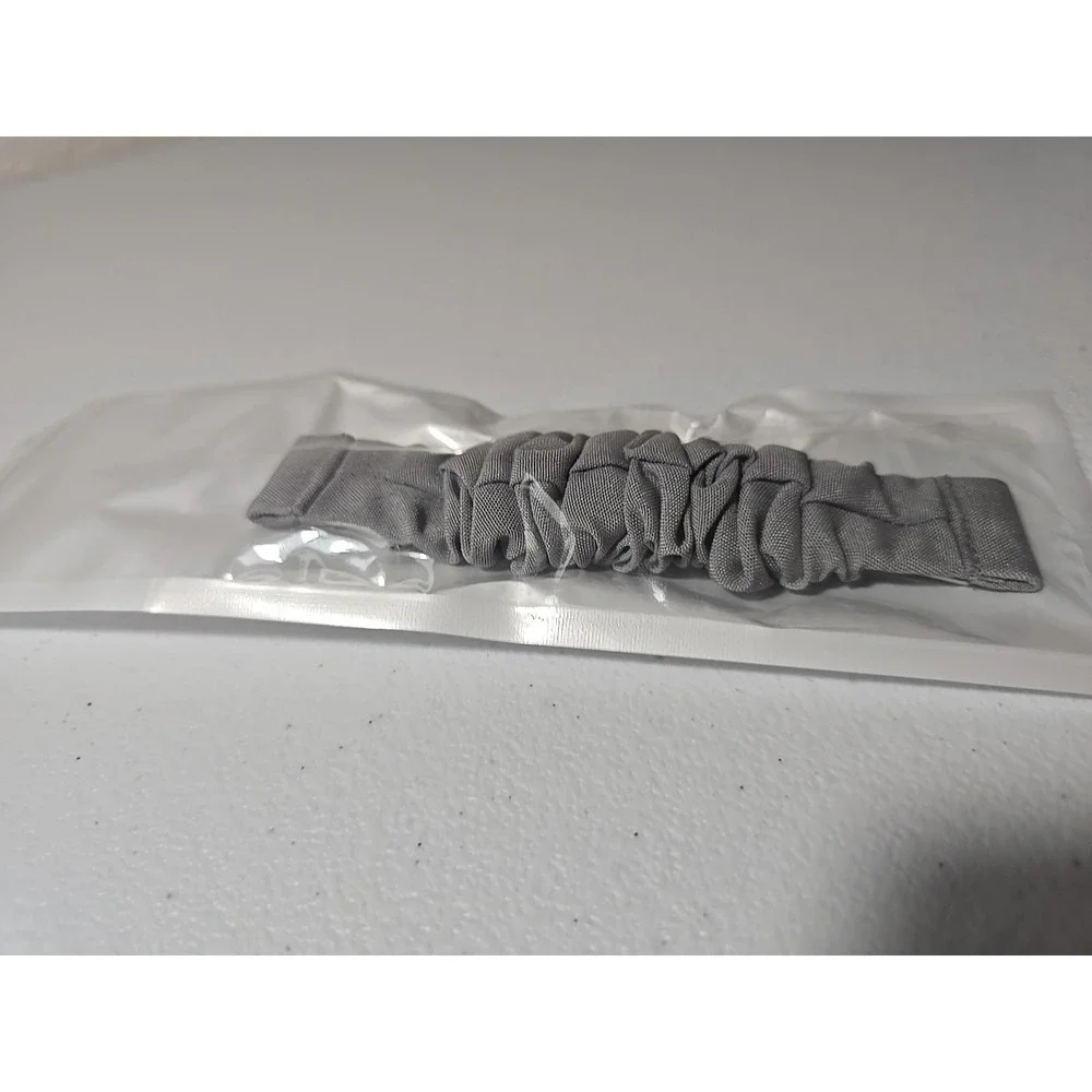 Scrunchie-style watch band for a fitness tracker, made of‎ a Gray, ruched fabric